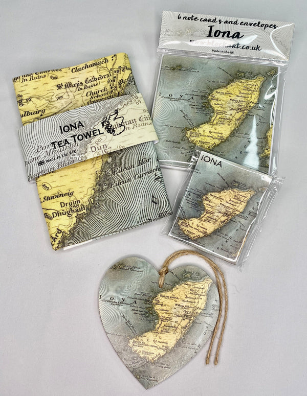 Group of products tea towel hanging decoration fridge magnet cards with Iona map image. Tea towel, fridge magnet, note cards, hanging heart decoration