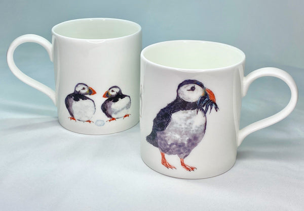 White bine china mugs with puffin design