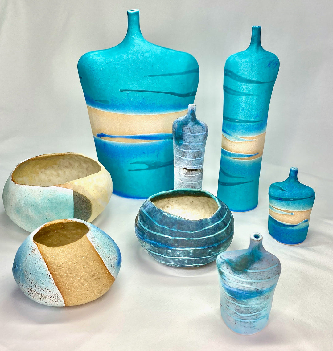 selection of fine stoneware vessels and figurative pieces in turquoise and blues