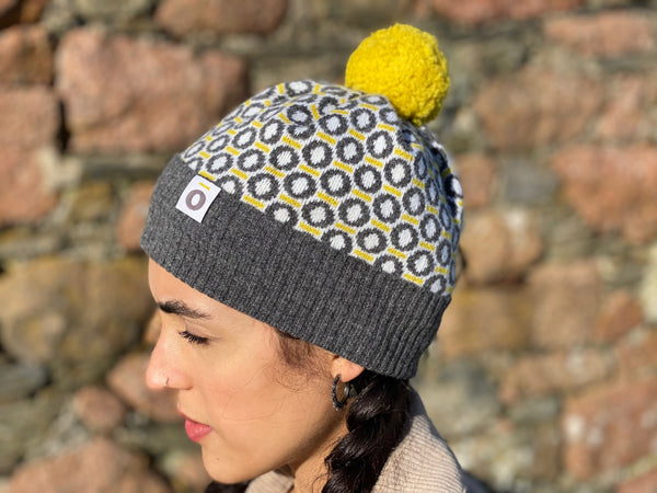 Scottish lambswool knitted bobble hat charcoal yellow with St Columba Iona halo design