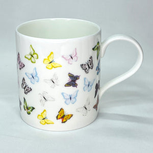 White bone china mug with multicoloured butterflies repeating pattern