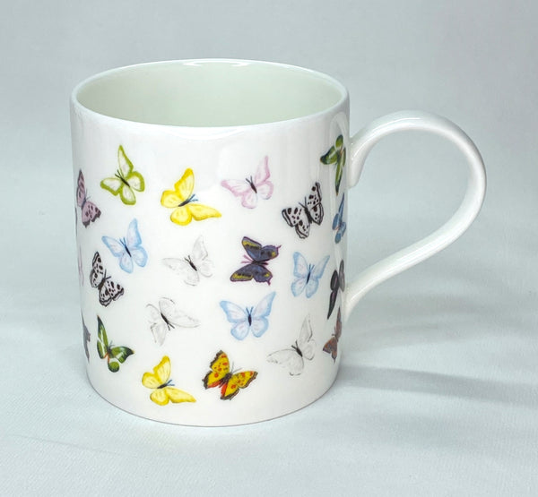 White bone china mug with multicoloured butterflies repeating pattern