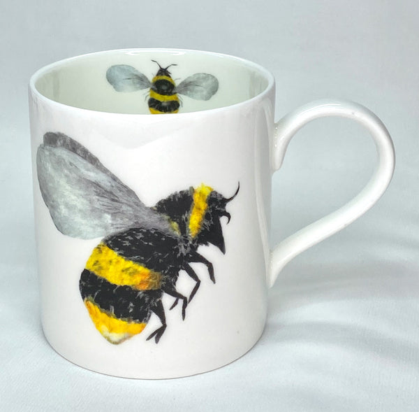 White bone china mug with bee design inside and outside