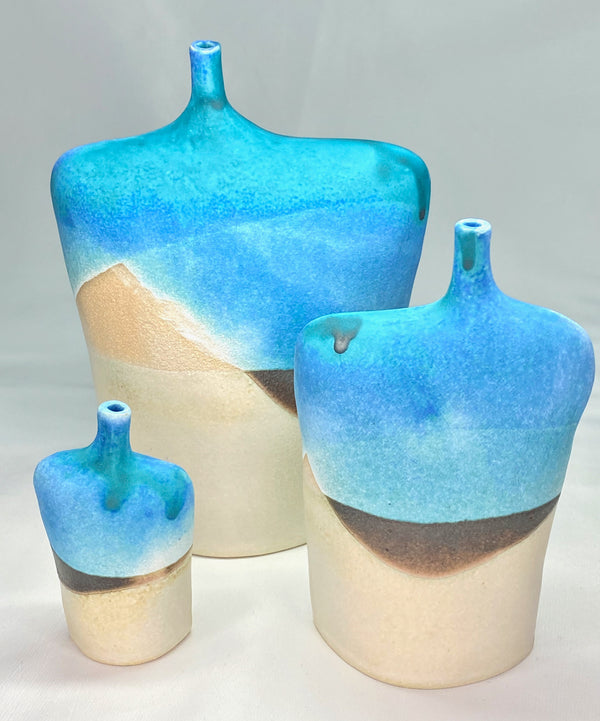 3 figurative stoneware bottles small medium large with turqouise brown and white glaze in an abstract landscape design