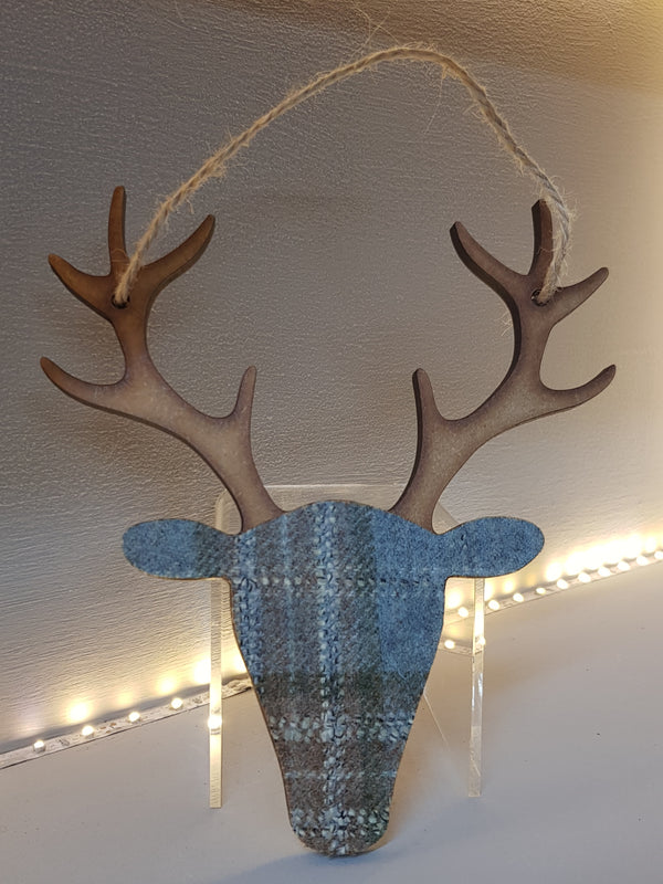 hanging stag head decoration wood and tartan in duck egg blue