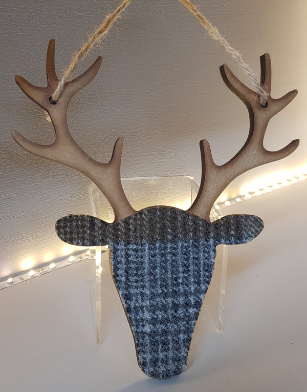 stag head decoration wood and tartan in greys
