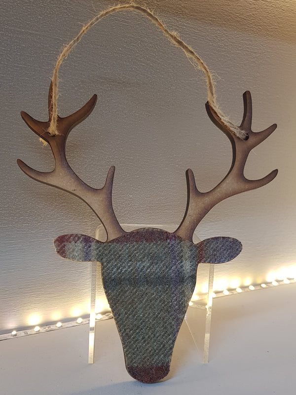 stag head decoration wood and tartan in reds and browns