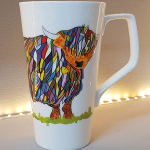 White bone china tall latte mug with bright multicolour highland cow design