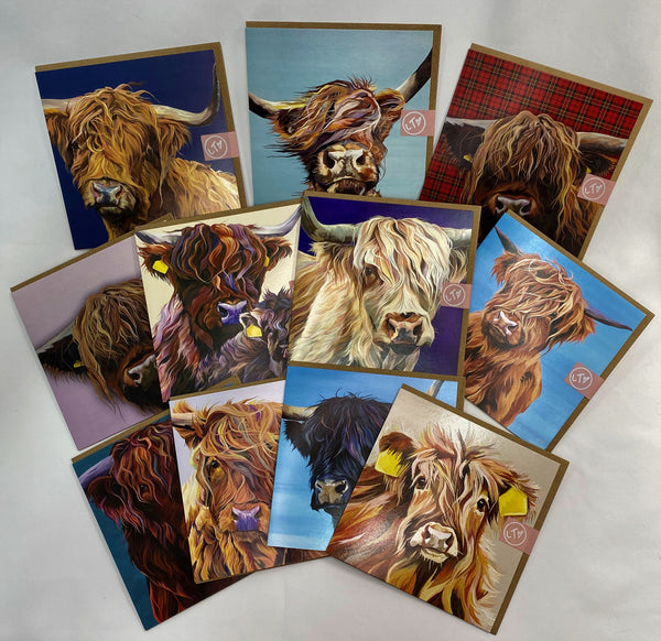 Selection of colourful greetings cards with different highland cow designs