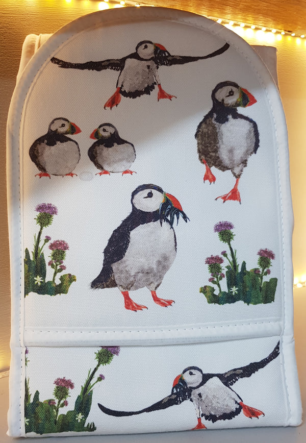 Oven gloves with puffins on a white background